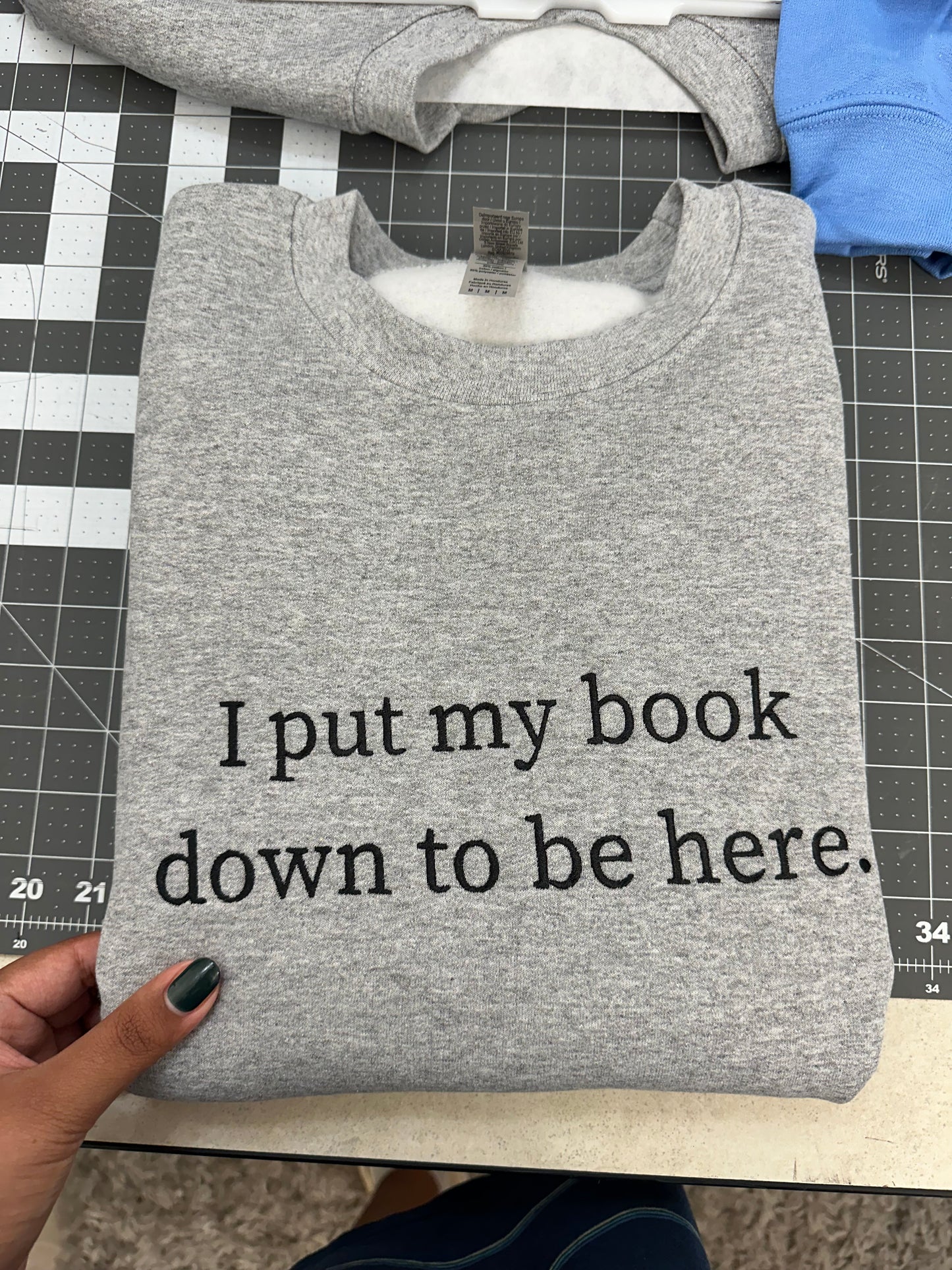 Oopsie Embroidered I Put My Book Down To Be Here Sweatshirt (Medium)