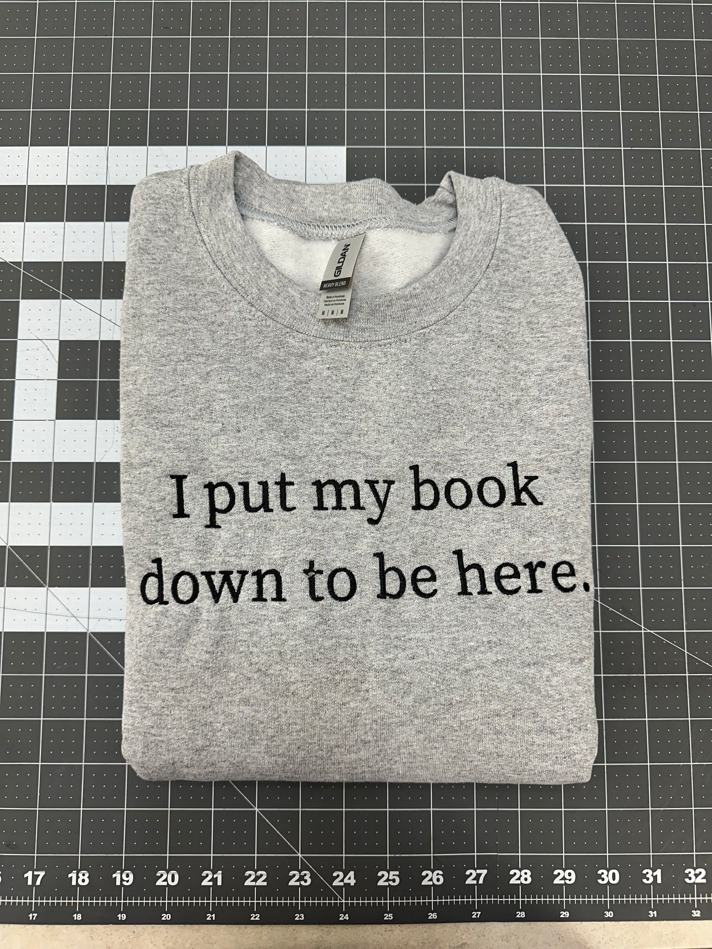 Oopsie Embroidered I Put My Book Down To Be Here Sweatshirt (Medium)