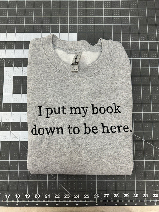 Oopsie Embroidered I Put My Book Down To Be Here Sweatshirt (Medium)