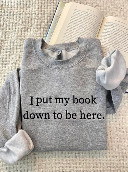 Embroidered I Put My Book Down To Be Here Sweatshirt